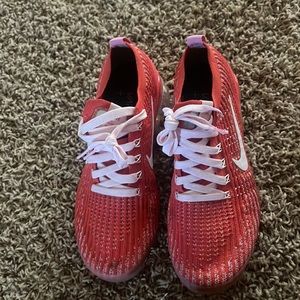 Pink and red Nike fly knit vapormax